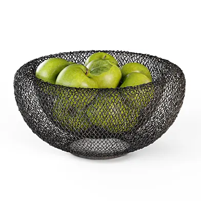 Green apples in a wicker metal vase