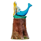 Wooden mermaid on the stump