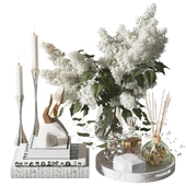 Decor with a bouquet of lilacs in a glass vase