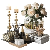 Decorative set with a bouquet of white roses in a glass vase
