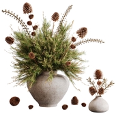 Pine branches in a rustic vase