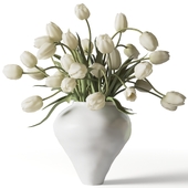 White tulips in a white clay vase